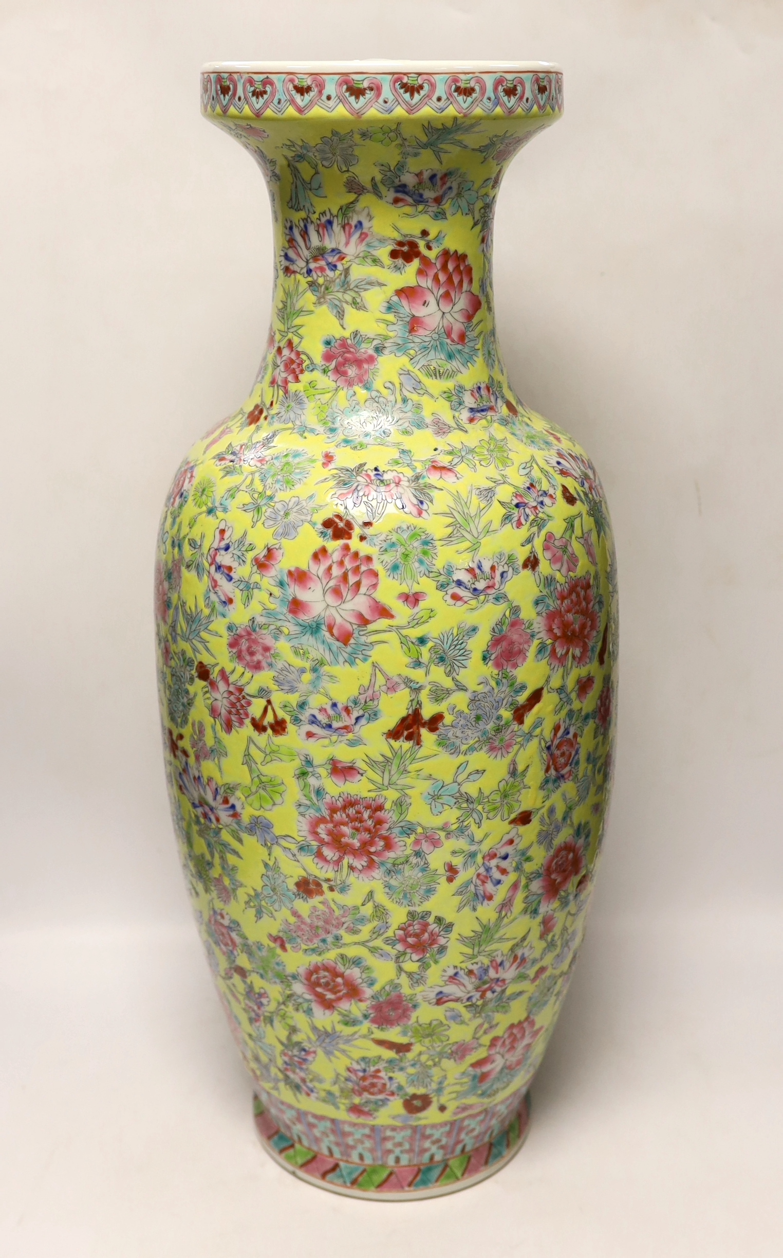 A large Chinese famille rose yellow ground baluster vase, 62cm high